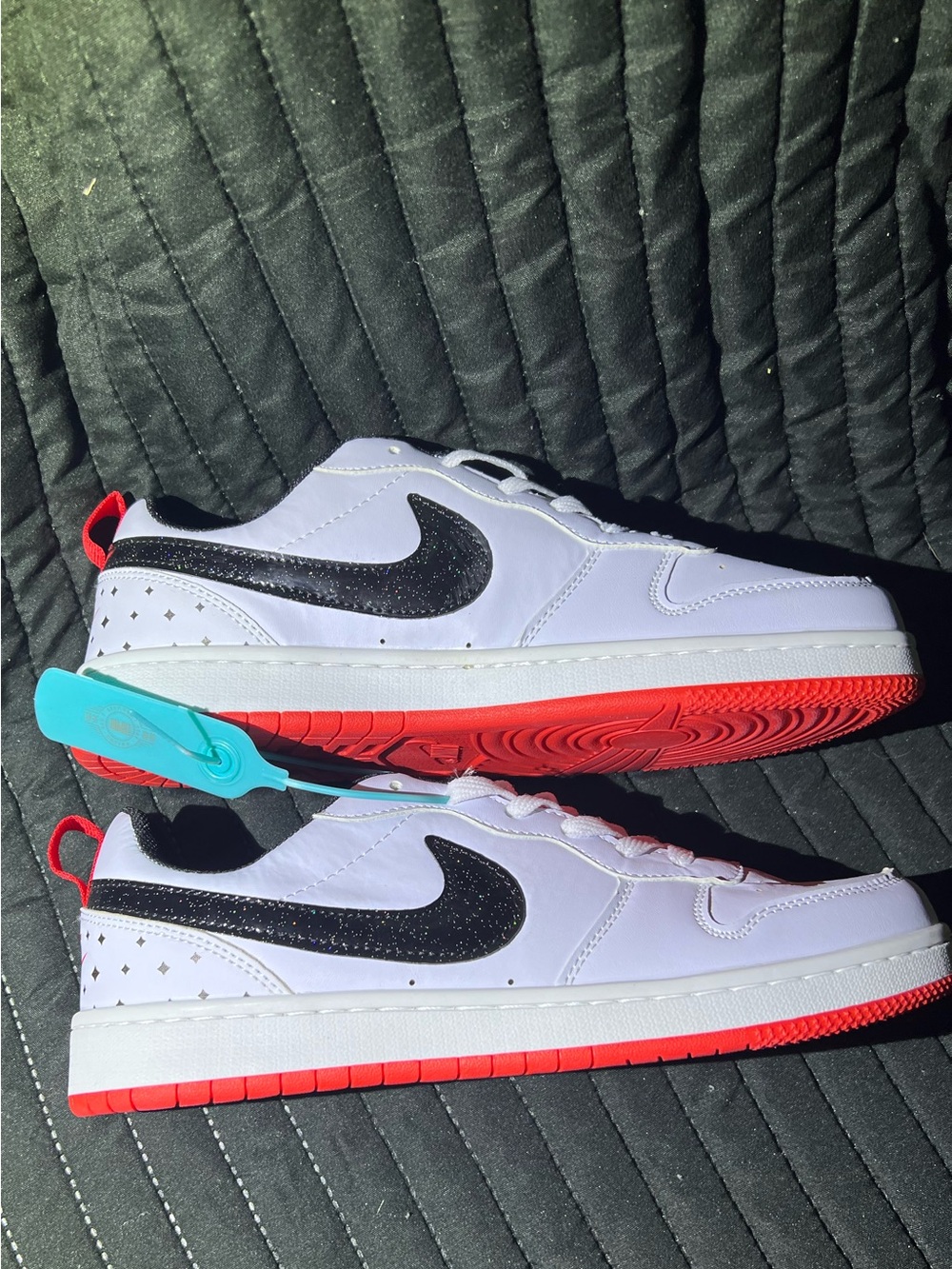 Nike White Low-Top Sneakers with Black Swoosh and Red Outsole - Picture 7 of 8